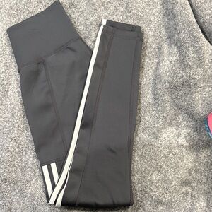 Women’s charcoal Adidas Leggings with White Stripes and side pockets